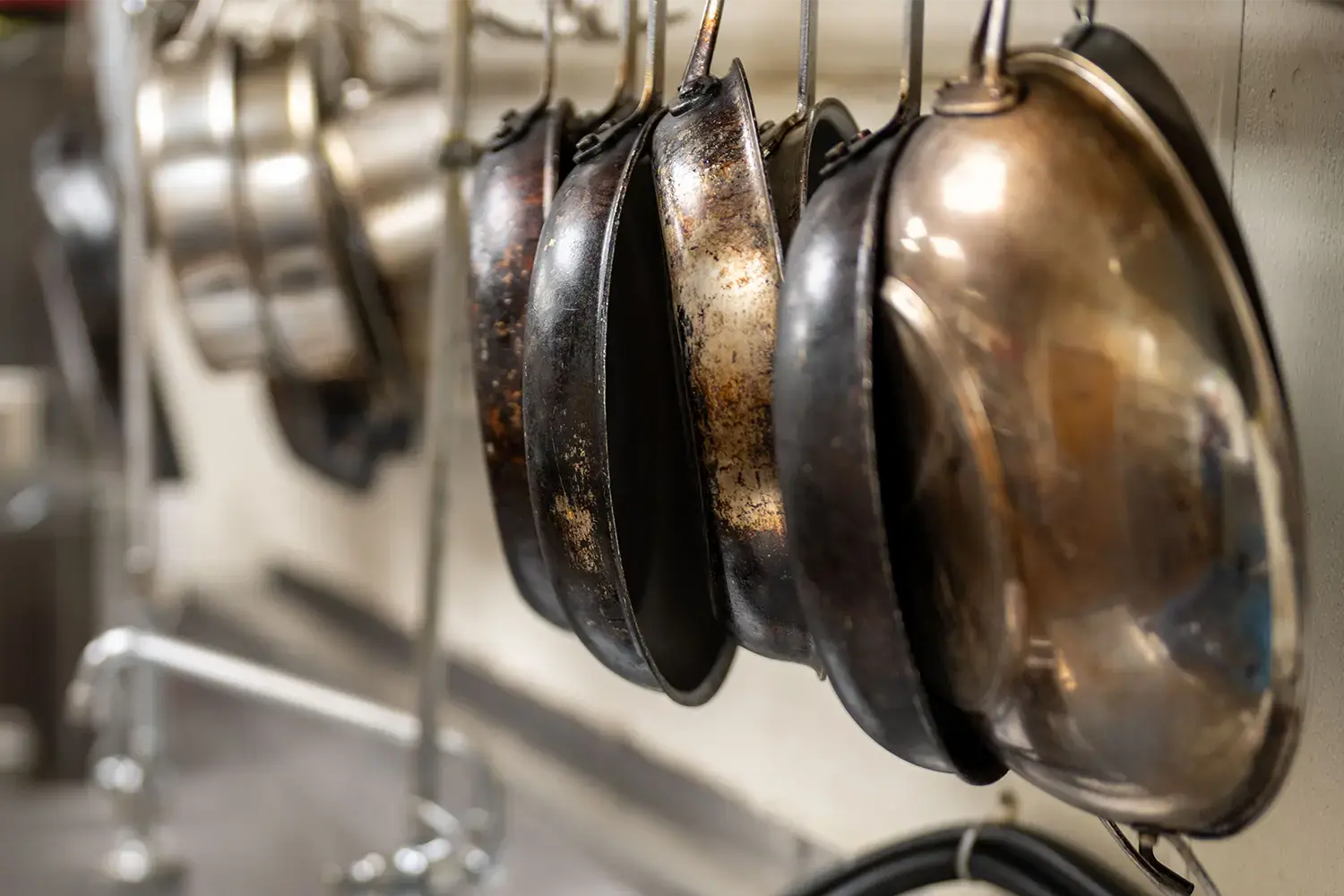 An image of a hanging rack of pans